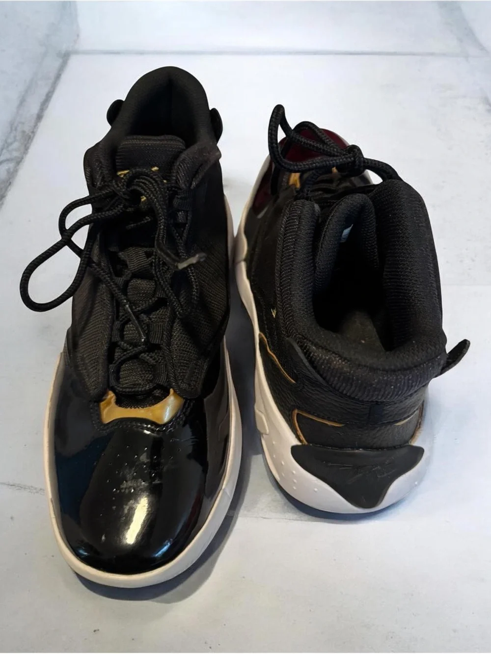 Jordan Kids Black and Gold High-Top Sneakers